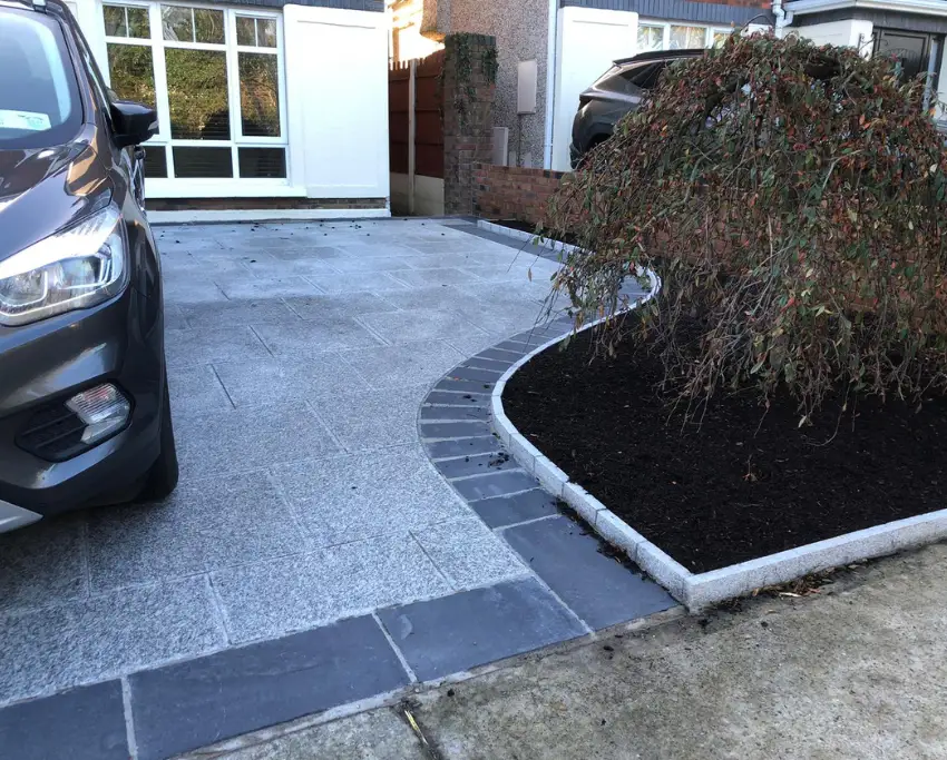 Granite paving outlined with striking black limestone